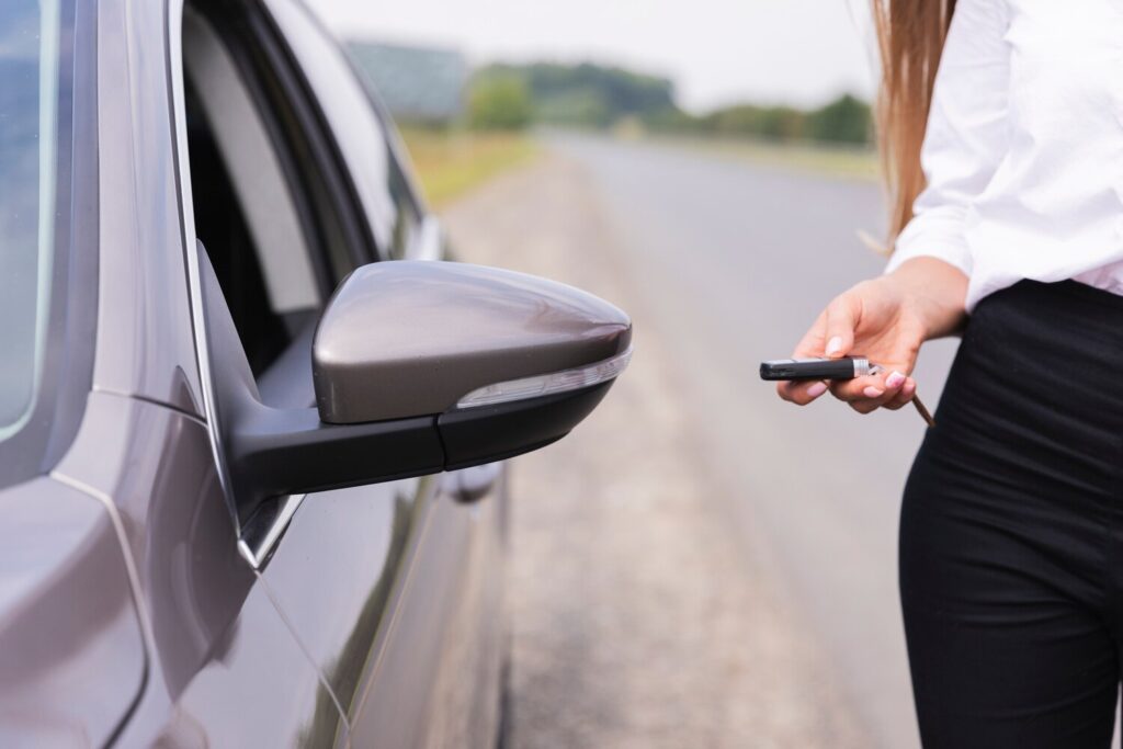 Woman locks car side road 23 2148266247